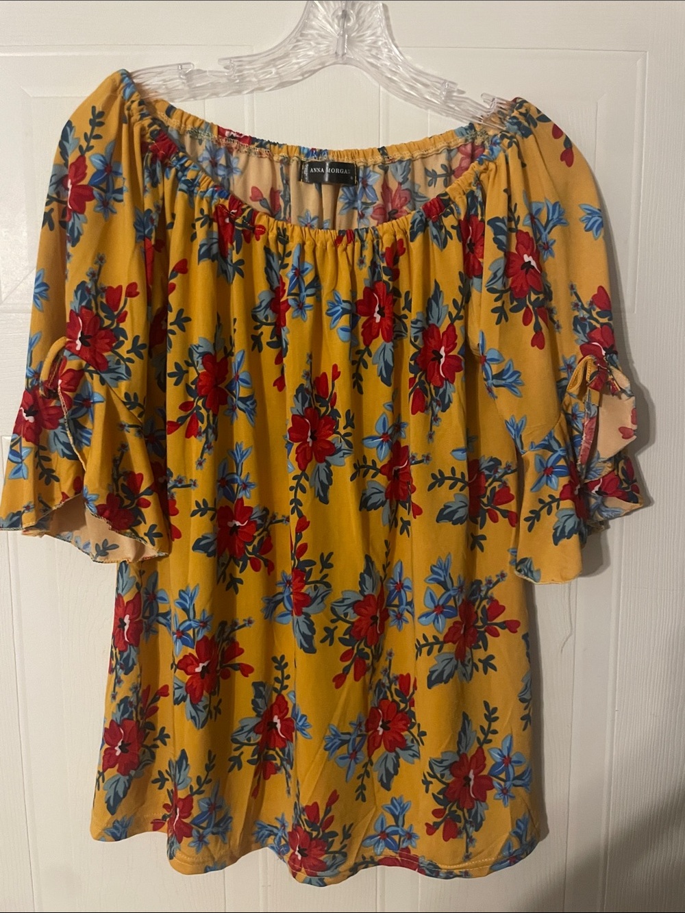 Anna Morgan yellow polyester with red and blue flowers blouse.